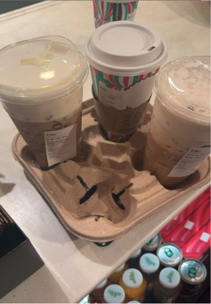 This photo shows two returning holiday drinks, the peppermint white mocha, and the Gingerbread Iced Chai, along with a warm custom coffee in a holiday cup. These drinks were made with love and spirit by the Hudson Starbucks staff.